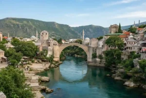 Historic Mostar Old Bridge and mountain landscape in Bosnia