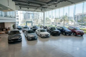 Pre-owned cars displayed inside a modern UAE used car showroom